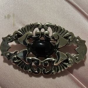 Elegant Silver and Black Brooch